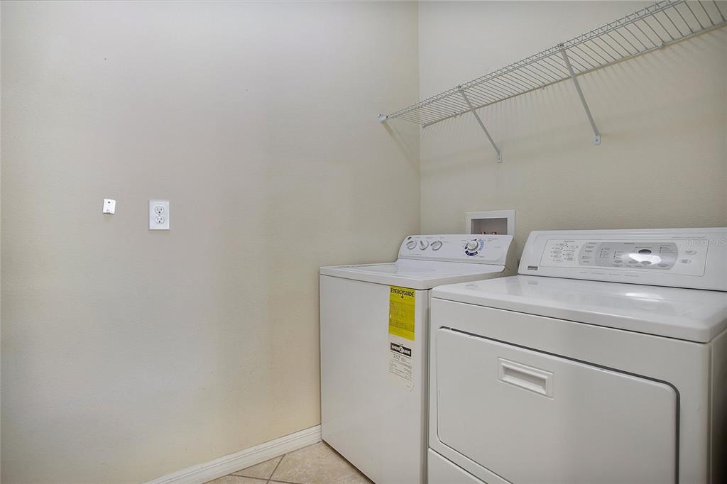 3216 Rodrick Circle Orlando, FL 32824 - Photo 18 of 33 a utility room with dryer and washer