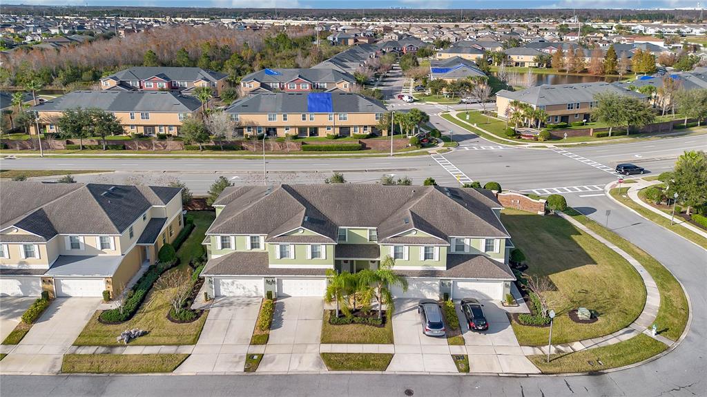 3216 Rodrick Circle Orlando, FL 32824 - Photo 25 of 33 an aerial view of residential houses with outdoor space and parking