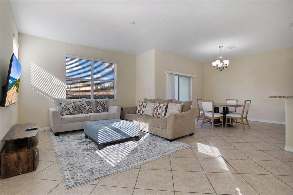 3216 Rodrick Circle Orlando, FL 32824 - Photo 3 of 33 a living room with furniture and a couch