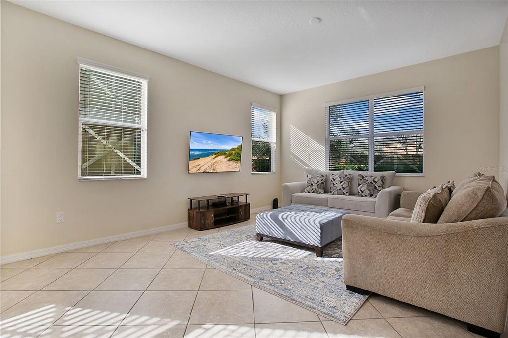 3216 Rodrick Circle Orlando, FL 32824 - Photo 4 of 33 a living room with furniture and a window