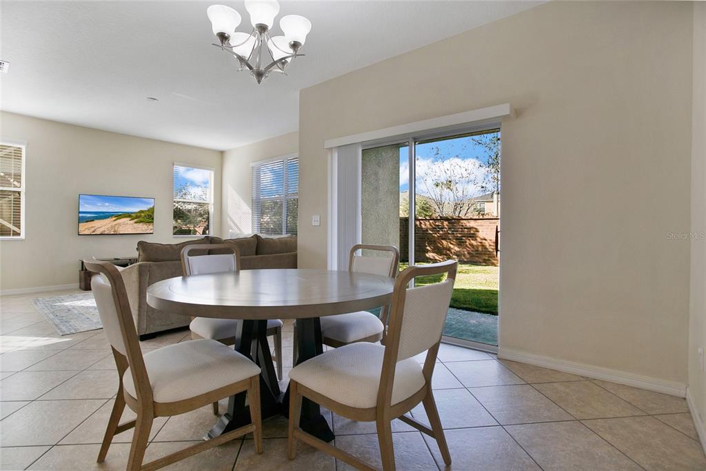 3216 Rodrick Circle Orlando, FL 32824 - Photo 5 of 33 a view of a dining room with furniture window and outside view