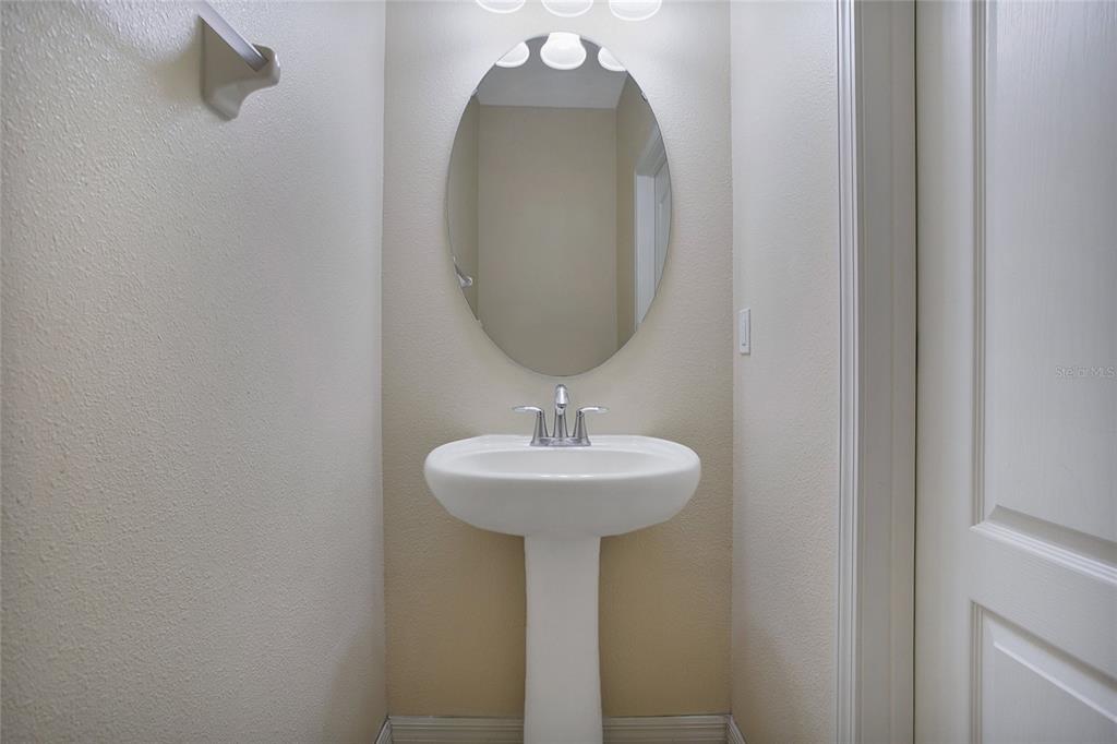 3216 Rodrick Circle Orlando, FL 32824 - Photo 10 of 33 a bathroom with a sink and a mirror