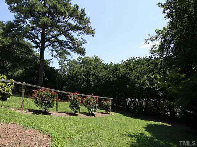 1724 Nottingham Road Raleigh, NC 27607 - Photo 24 of 25 The back yard is 3/4 fenced for dogs. Wonderful lot adjacent to greenway in far right corner.