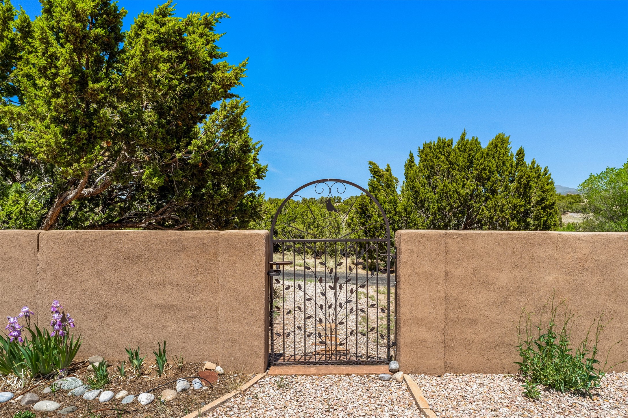 79 East Chili Line Road Santa Fe, NM 87508 - Photo 41 of 46 Wrought iron gate to walking trail