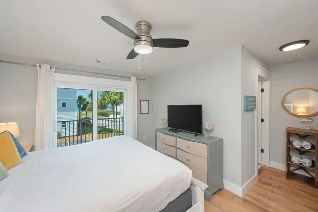 a bedroom with a bed and a television