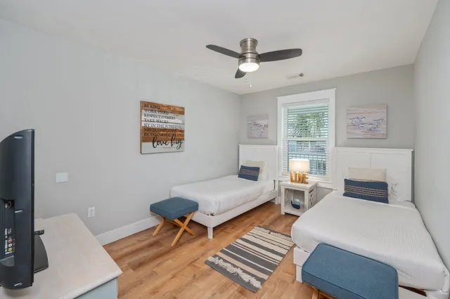 a bedroom with furniture and a window