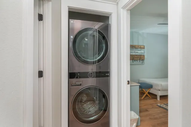 a view of a bedroom with washer and dryer