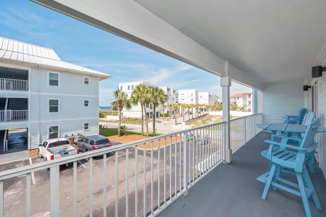 a view of a chairs and table in patio