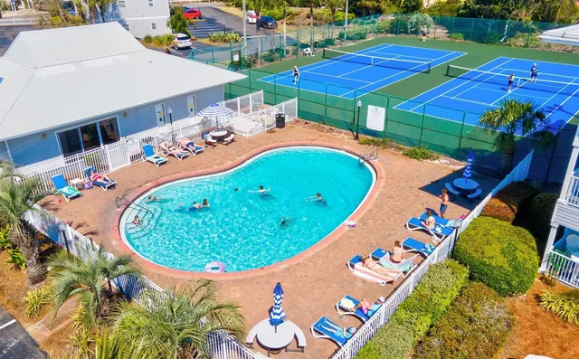 an aerial view of a chairs and table