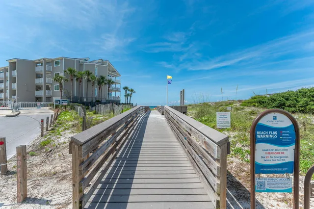 a view of balcony with wooden floor and fence