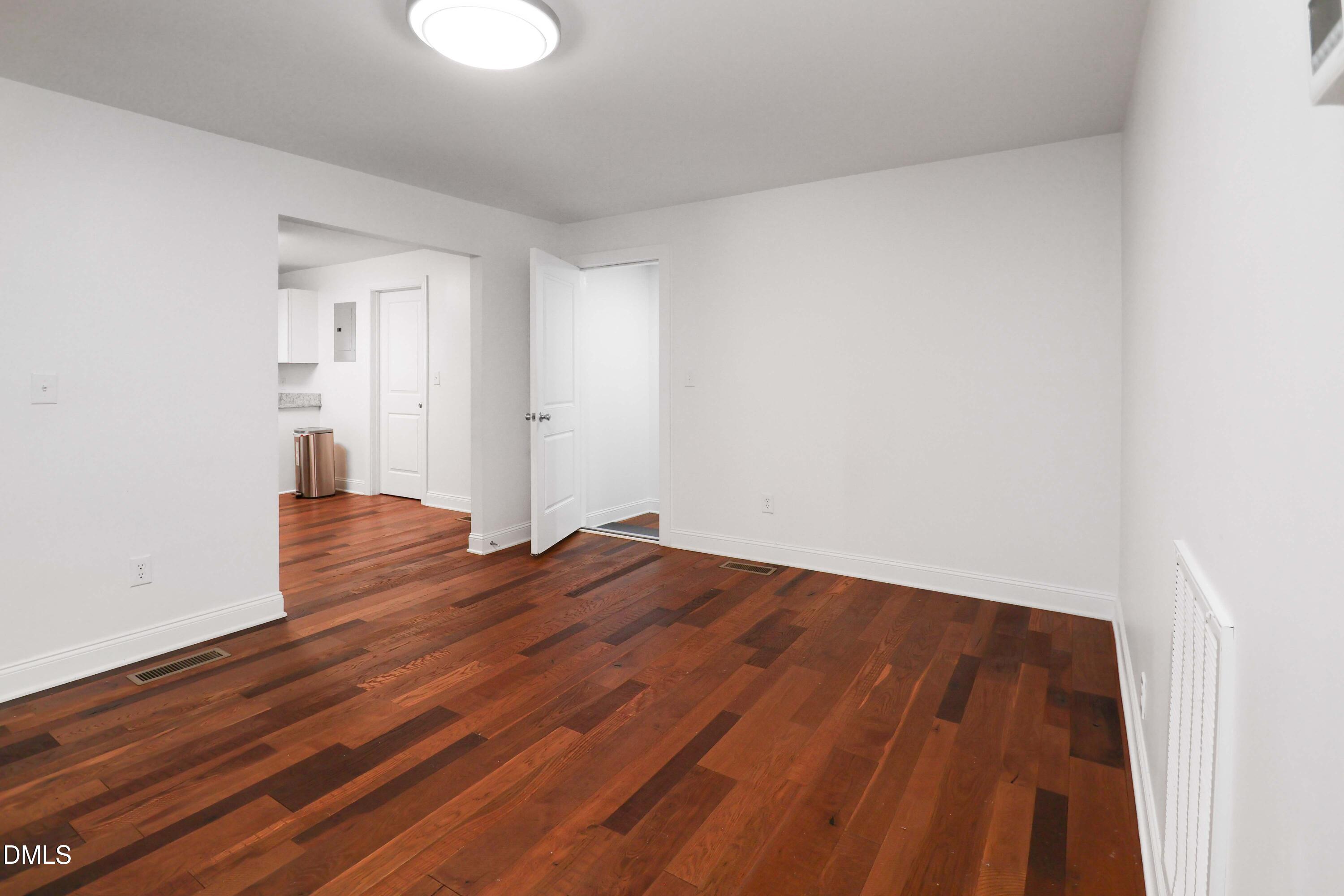 5209 Durham Road Raleigh, NC 27613 - Photo 8 of 18 a view of a room with wooden floor