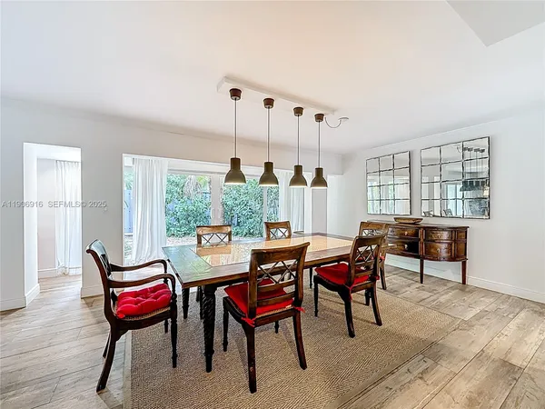 a living room with furniture a window and a table