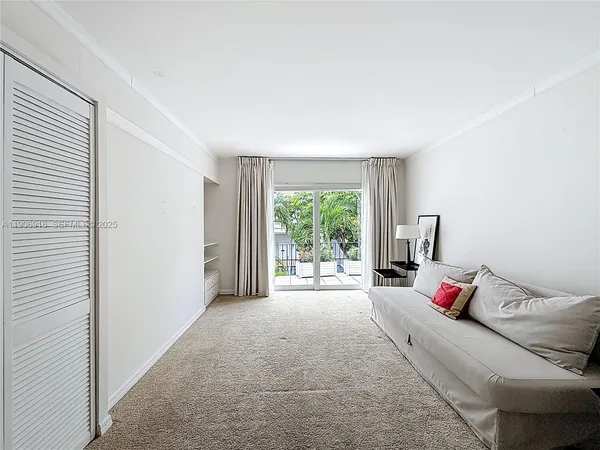 a bed room with a bed and a window