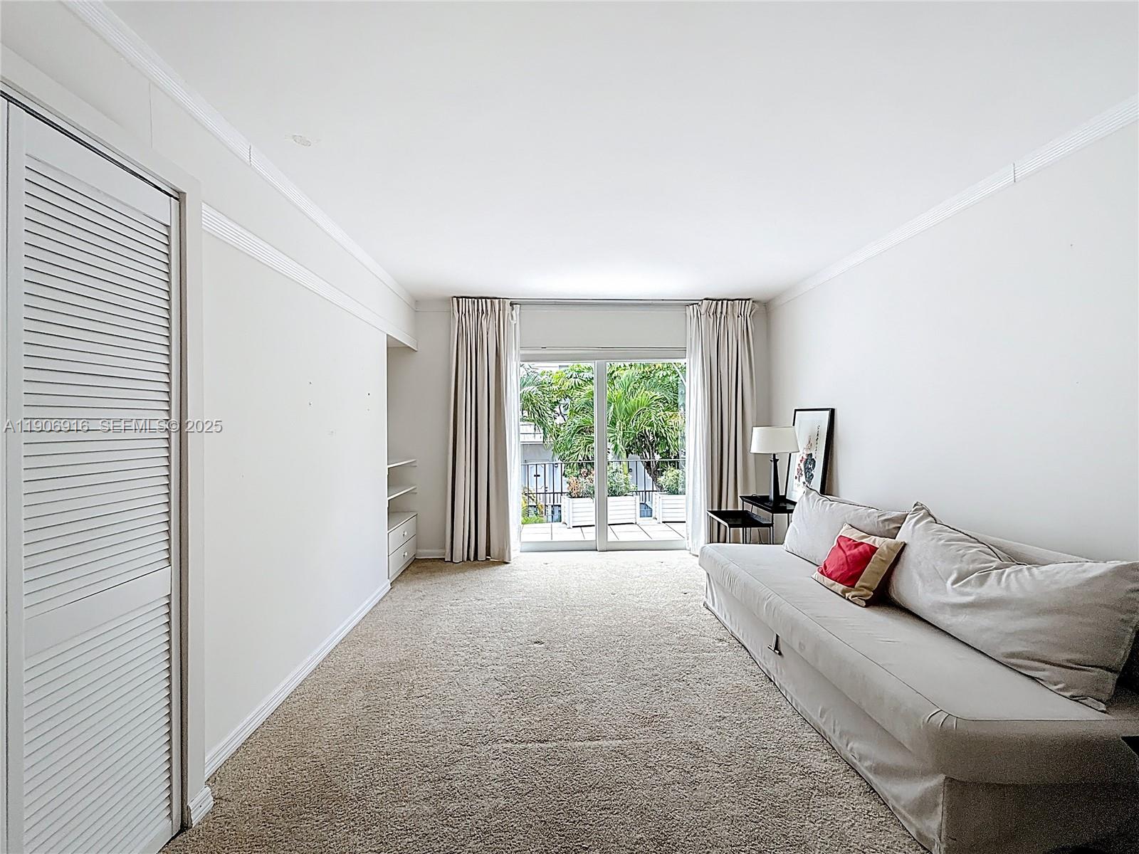 254 Seaview Drive, Unit 5 Key Biscayne, FL 33149 - Photo 22 of 30 a bed room with a bed and a window