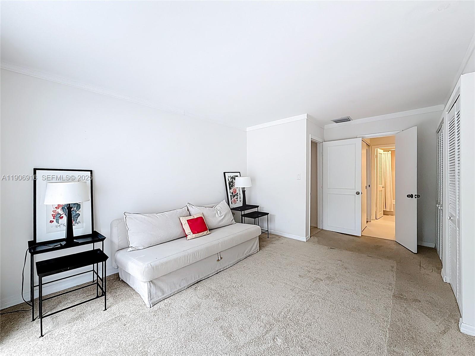 254 Seaview Drive, Unit 5 Key Biscayne, FL 33149 - Photo 23 of 30 a living room with furniture and white walls