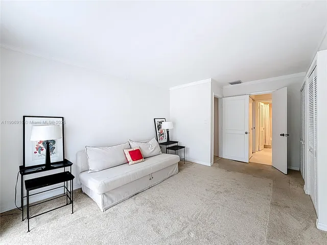 a living room with furniture and a night stand
