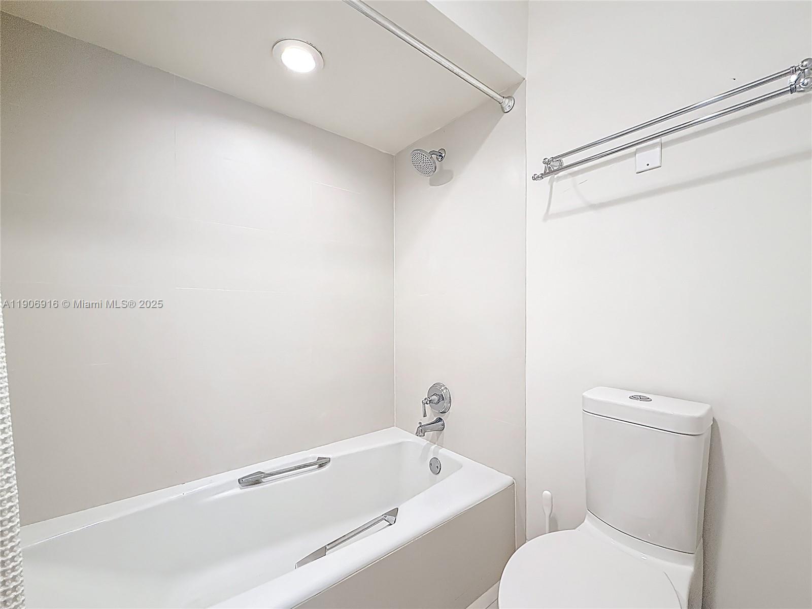 Key Biscayne Key Biscayne, FL 33149 - Photo 27 of 30 a bathroom with a toilet and a bathtub