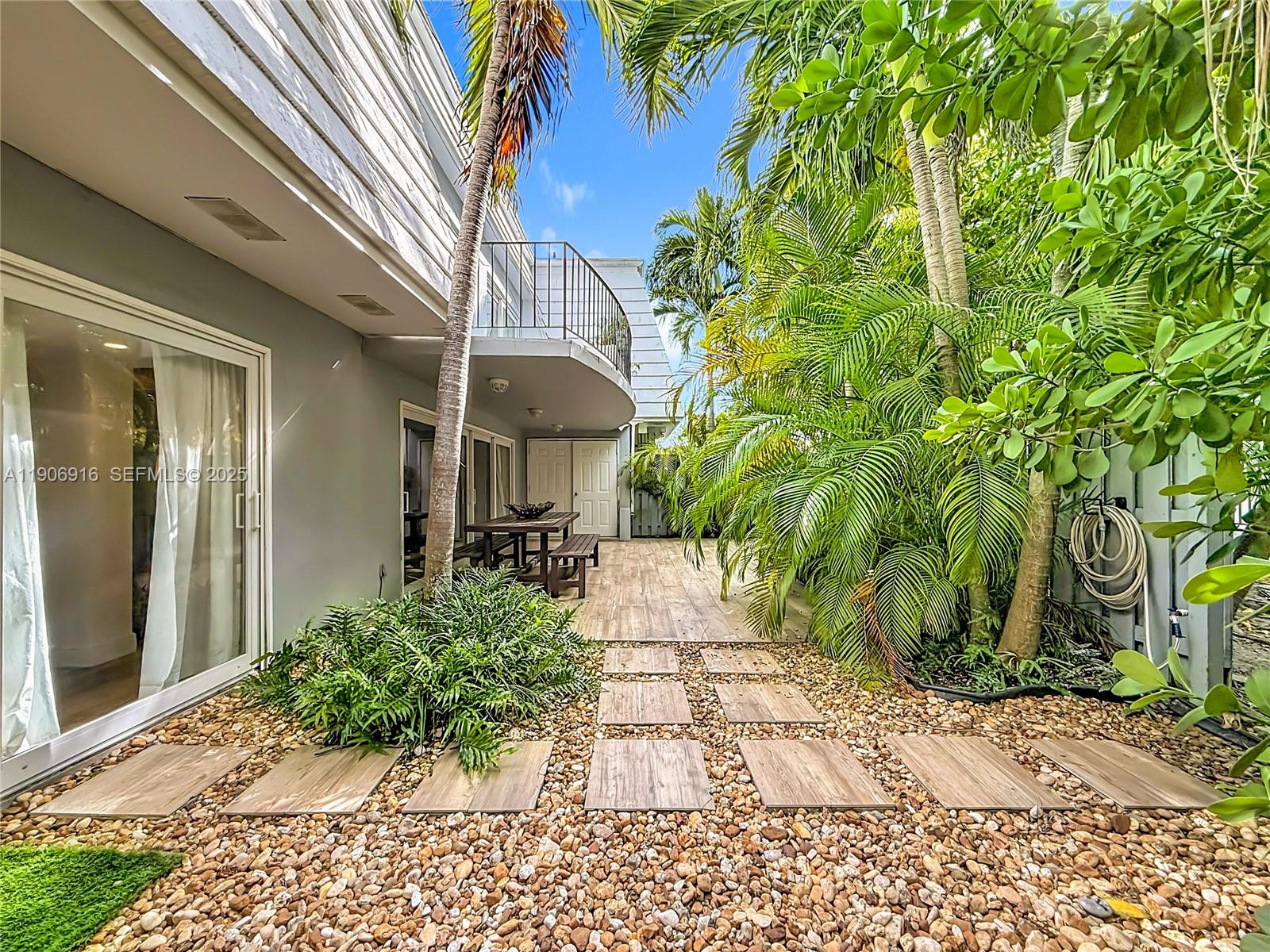 254 Seaview Drive, Unit 5 Key Biscayne, FL 33149 - Photo 30 of 30 a view of a house with a yard
