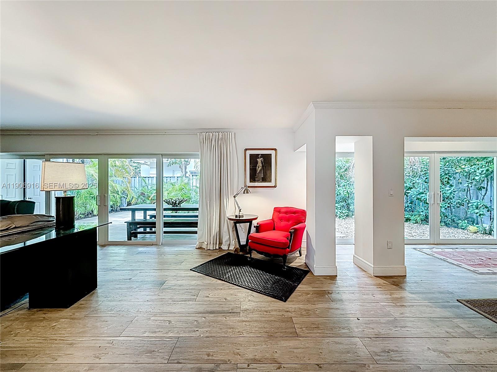 254 Seaview Drive, Unit 5 Key Biscayne, FL 33149 - Photo 6 of 30 a living room with furniture and a large window