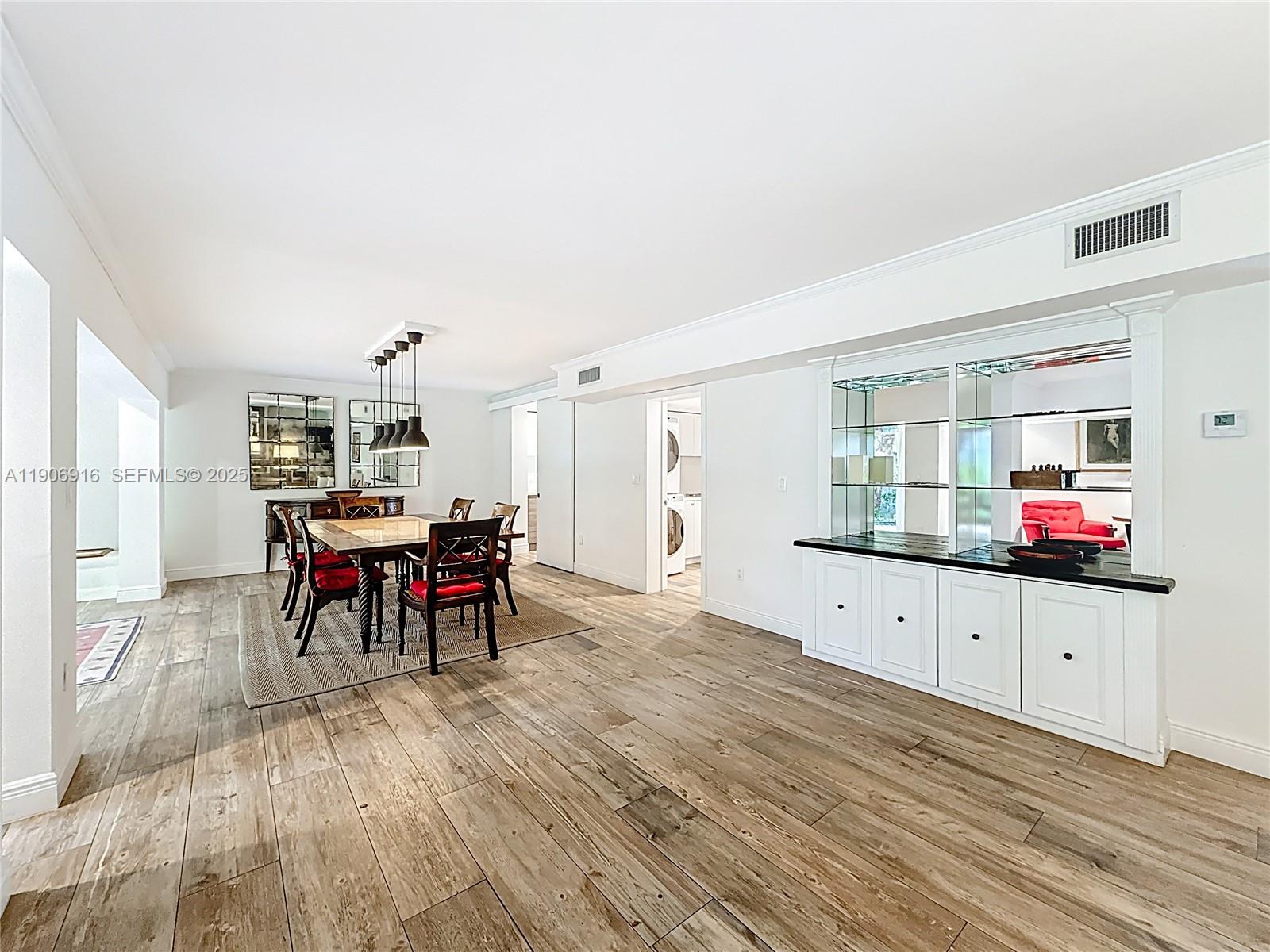 254 Seaview Drive, Unit 5 Key Biscayne, FL 33149 - Photo 9 of 30 a living room with furniture and a wooden floor