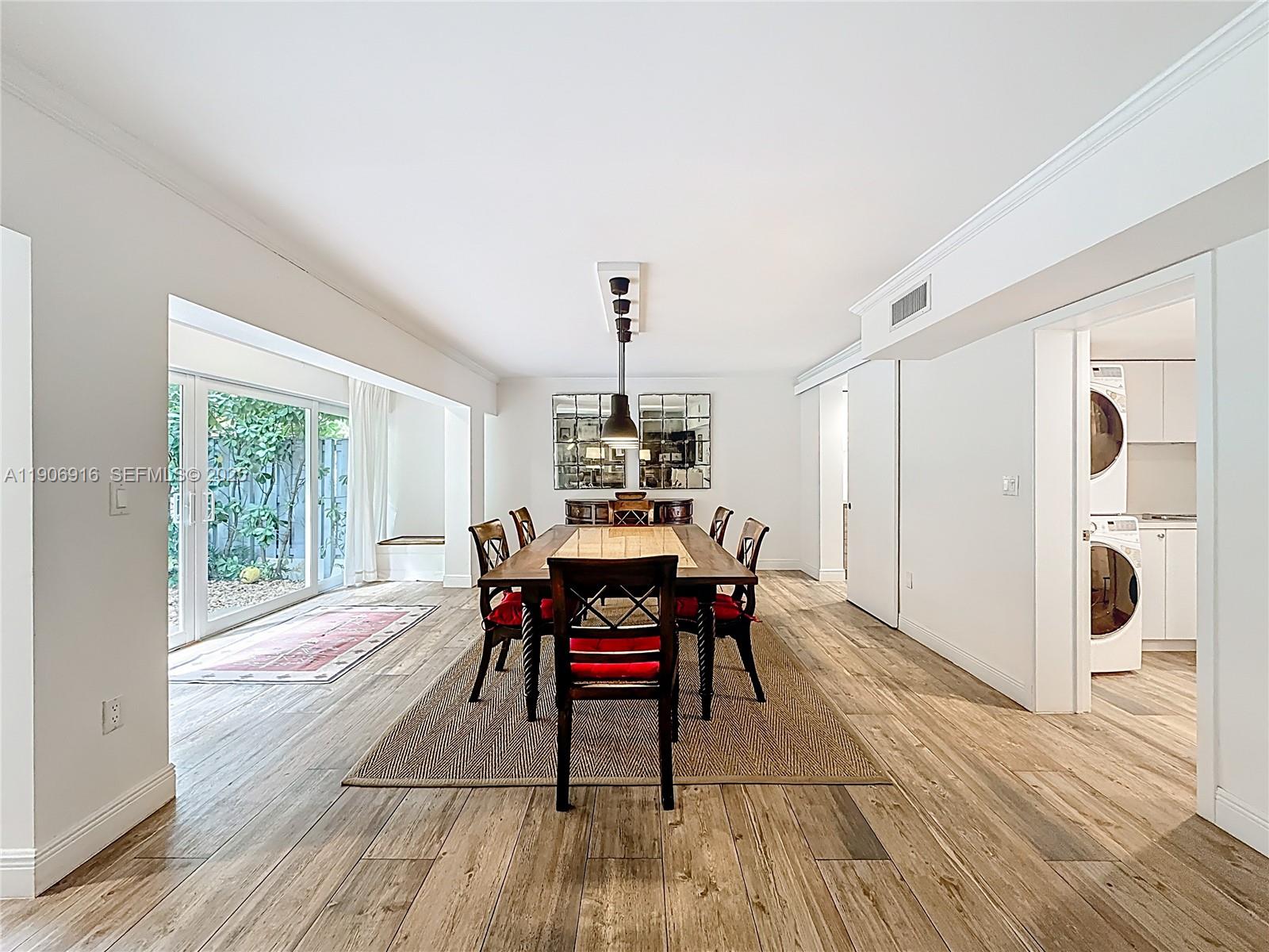 254 Seaview Drive, Unit 5 Key Biscayne, FL 33149 - Photo 10 of 30 a dining room with furniture window wooden floor