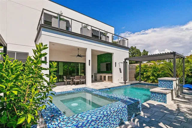 a view of an outside dining space with furniture