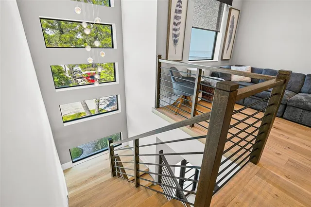 a bed room with furniture and a flat screen tv