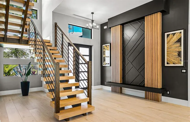 a view of an entryway with wooden floor