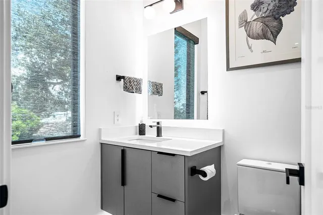 a living room with furniture a rug and a flat screen tv