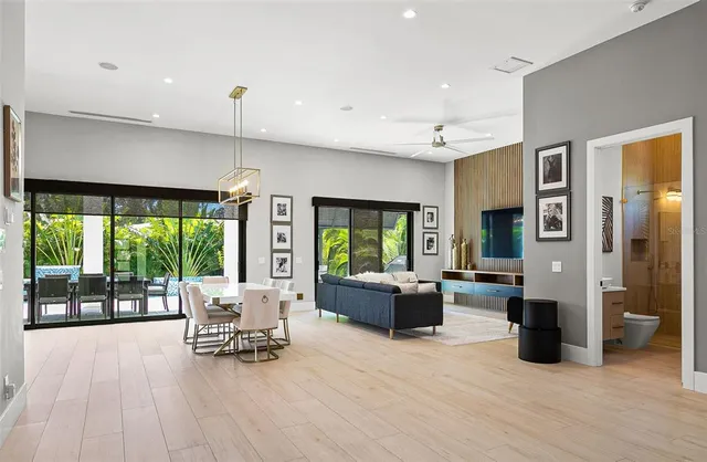 a living room with furniture and large windows