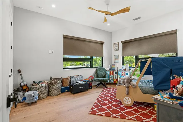 a view of a house with a yard and garden