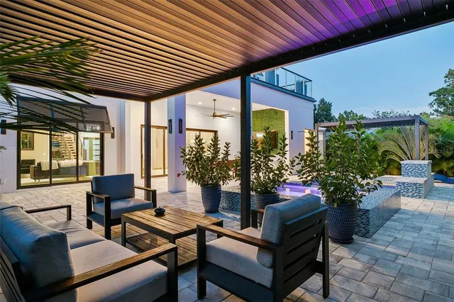 an aerial view of a house with garden space and plants