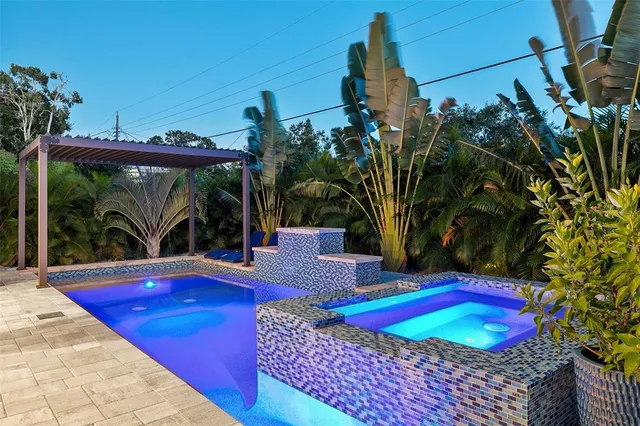 an aerial view of residential houses with city view