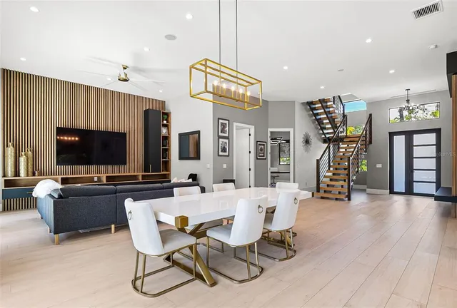a view of a livingroom with furniture and a flat screen tv