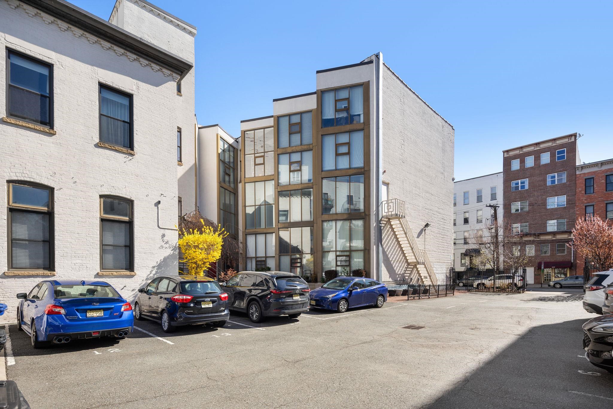 222 Clinton Street, Unit 13 Hoboken, NJ 07030 - Photo 9 of 16 a view of a cars park in front of a building