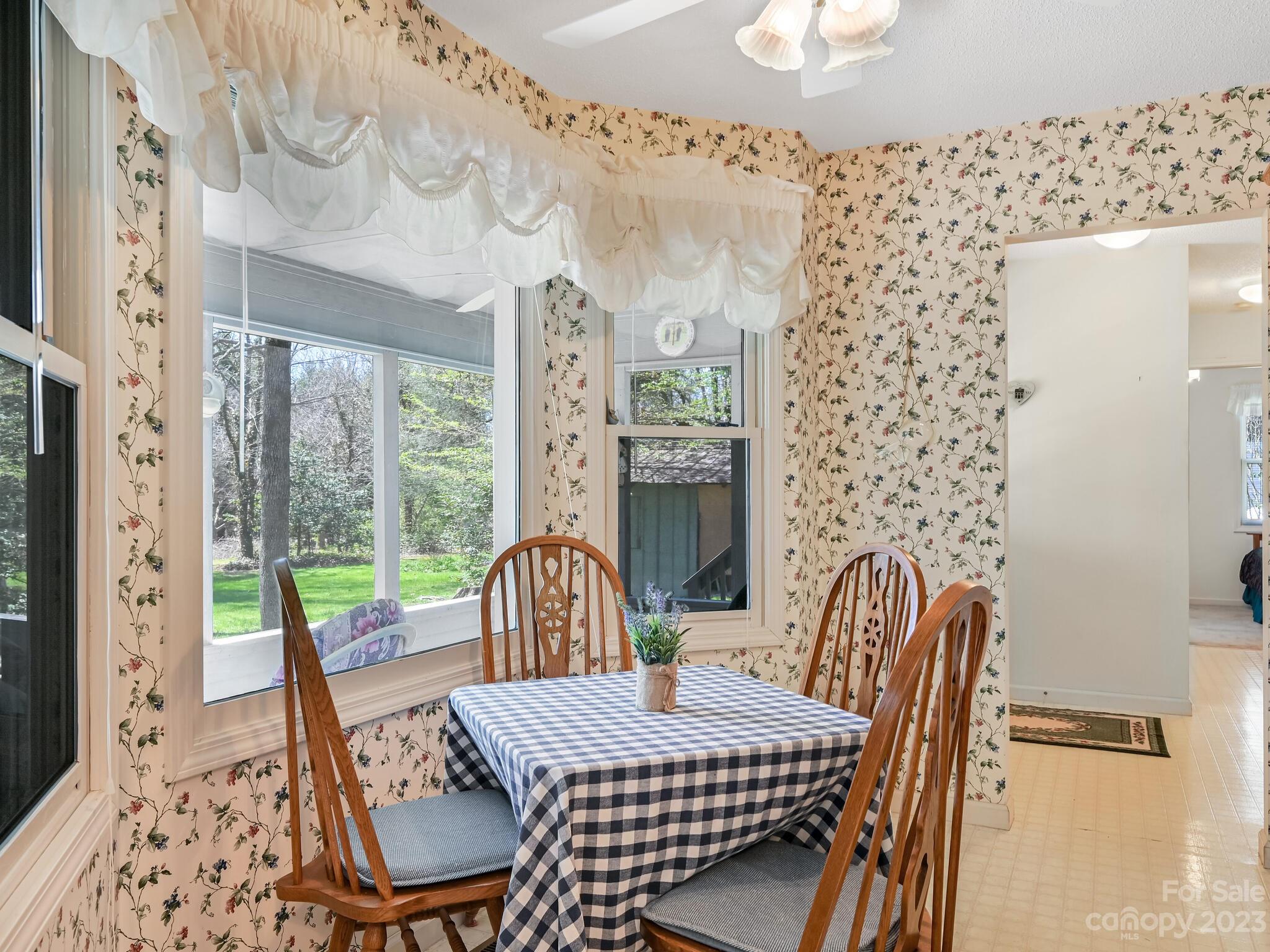 15 Maple Road Arden, NC 28704 - Photo 12 of 33 a living room with furniture a large window and a table