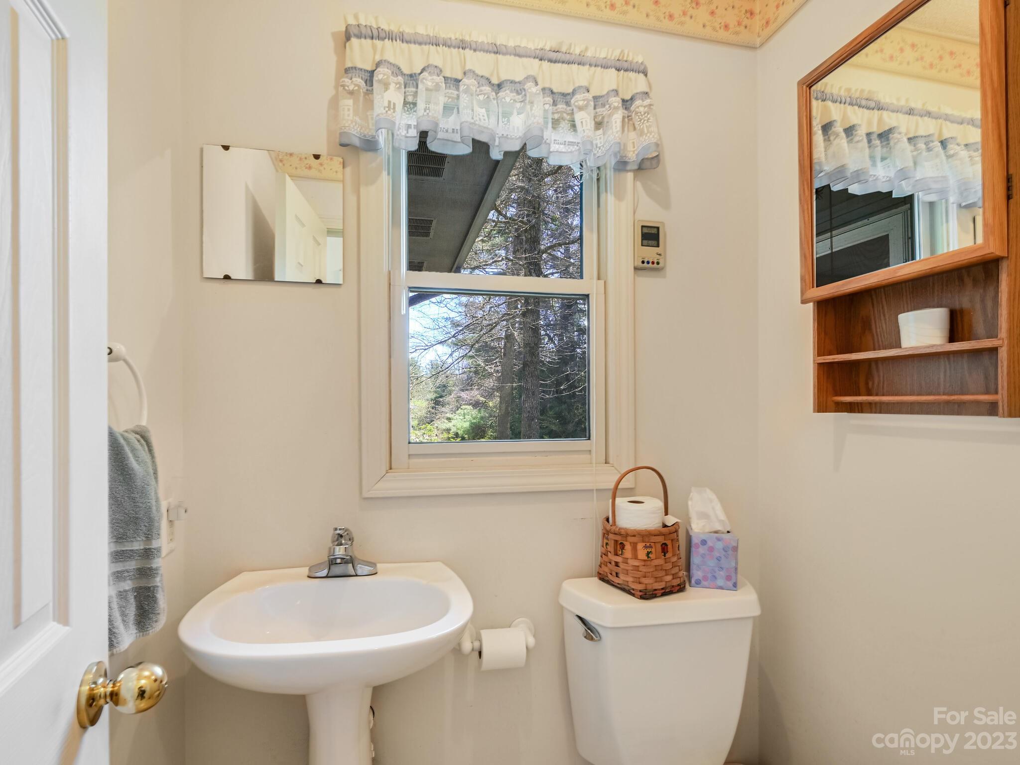 15 Maple Road Arden, NC 28704 - Photo 13 of 33 a bathroom with a sink toilet and shower