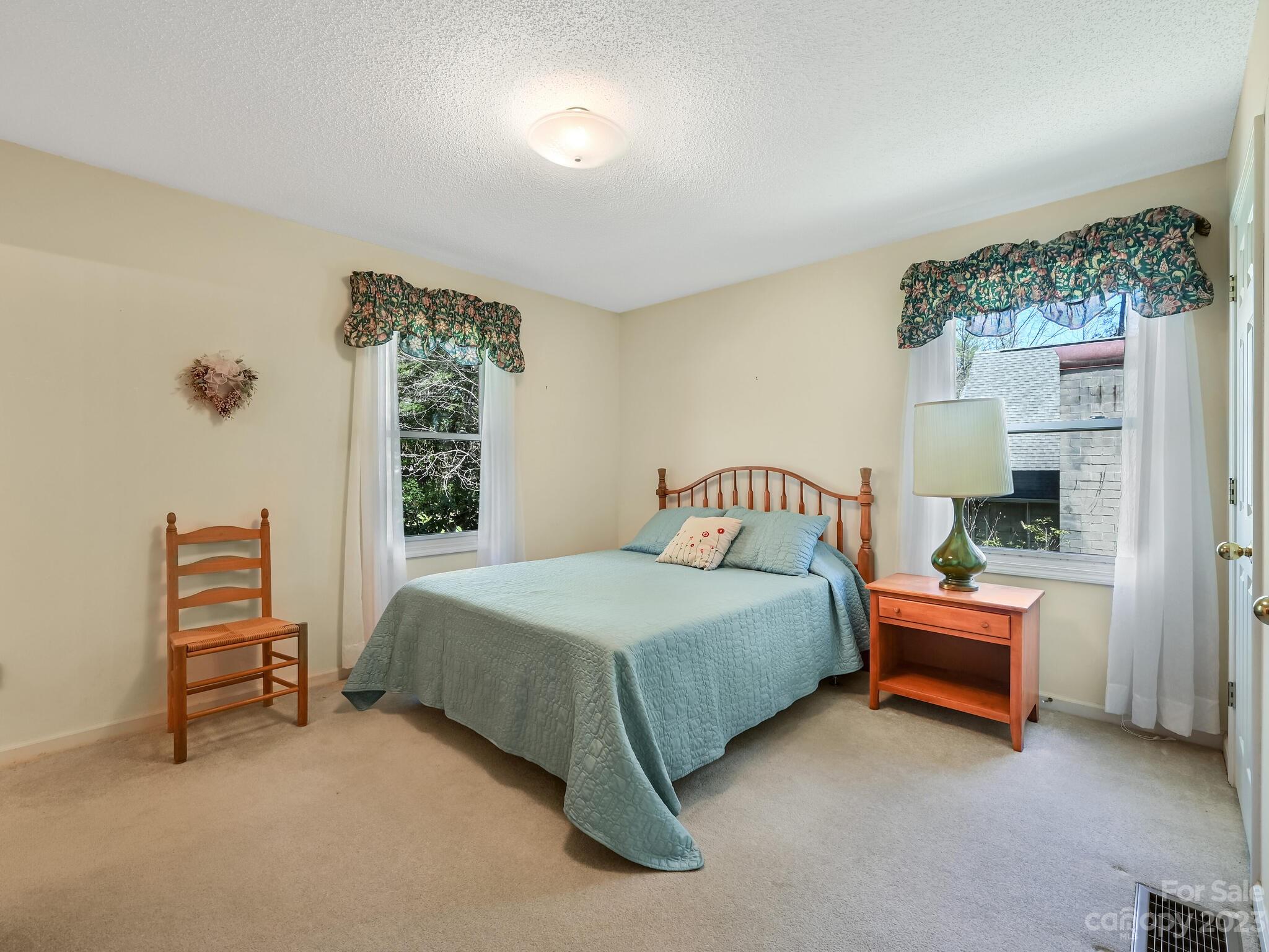 15 Maple Road Arden, NC 28704 - Photo 14 of 33 a bedroom with a bed and a window