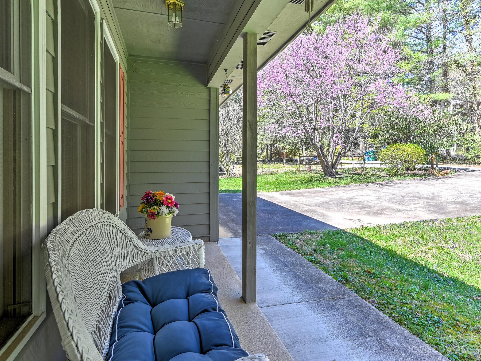 15 Maple Road Arden, NC 28704 - Photo 2 of 33 a view of a porch with furniture and a yard