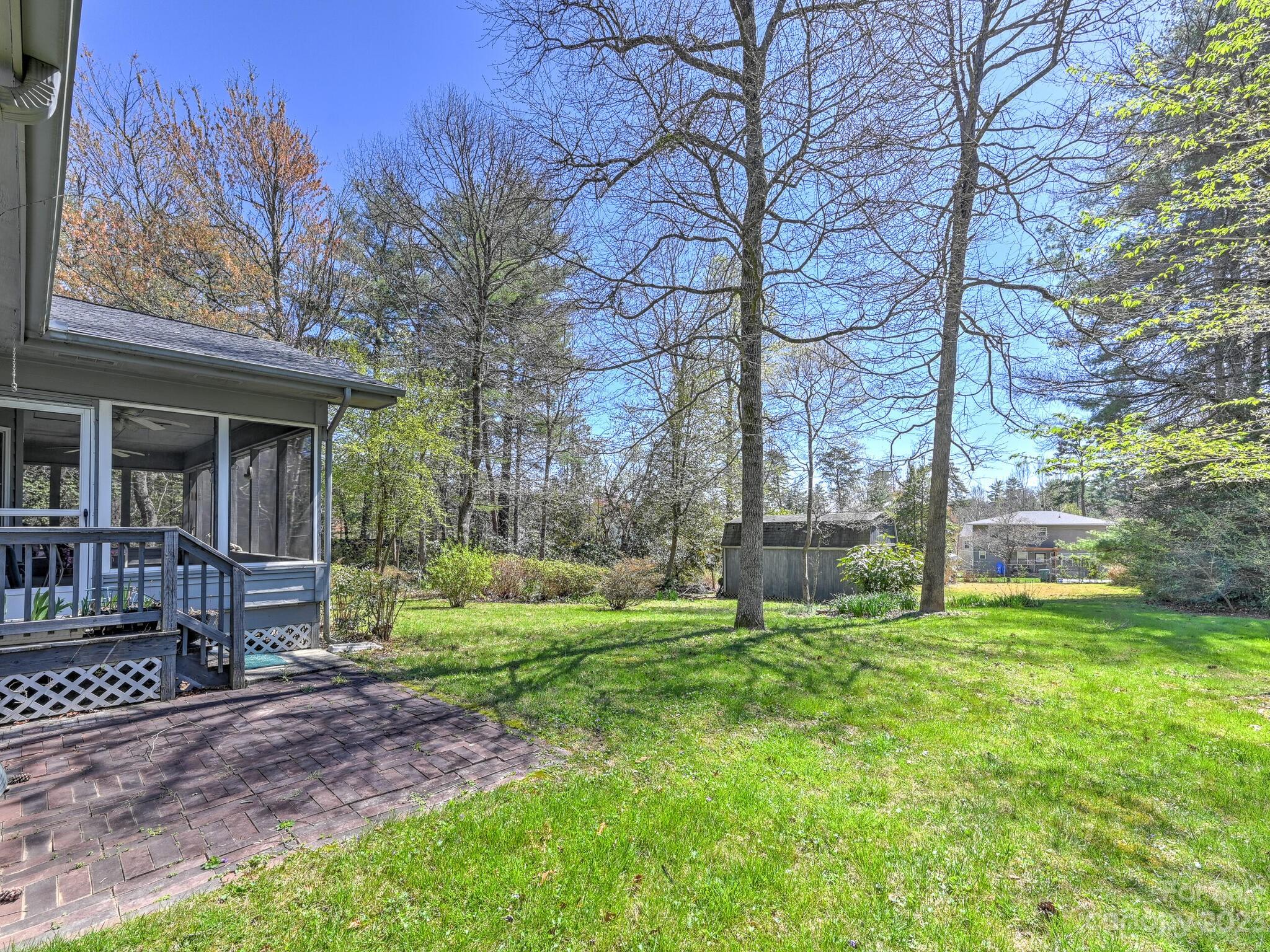 15 Maple Road Arden, NC 28704 - Photo 27 of 33 a view of a house with backyard and a tree