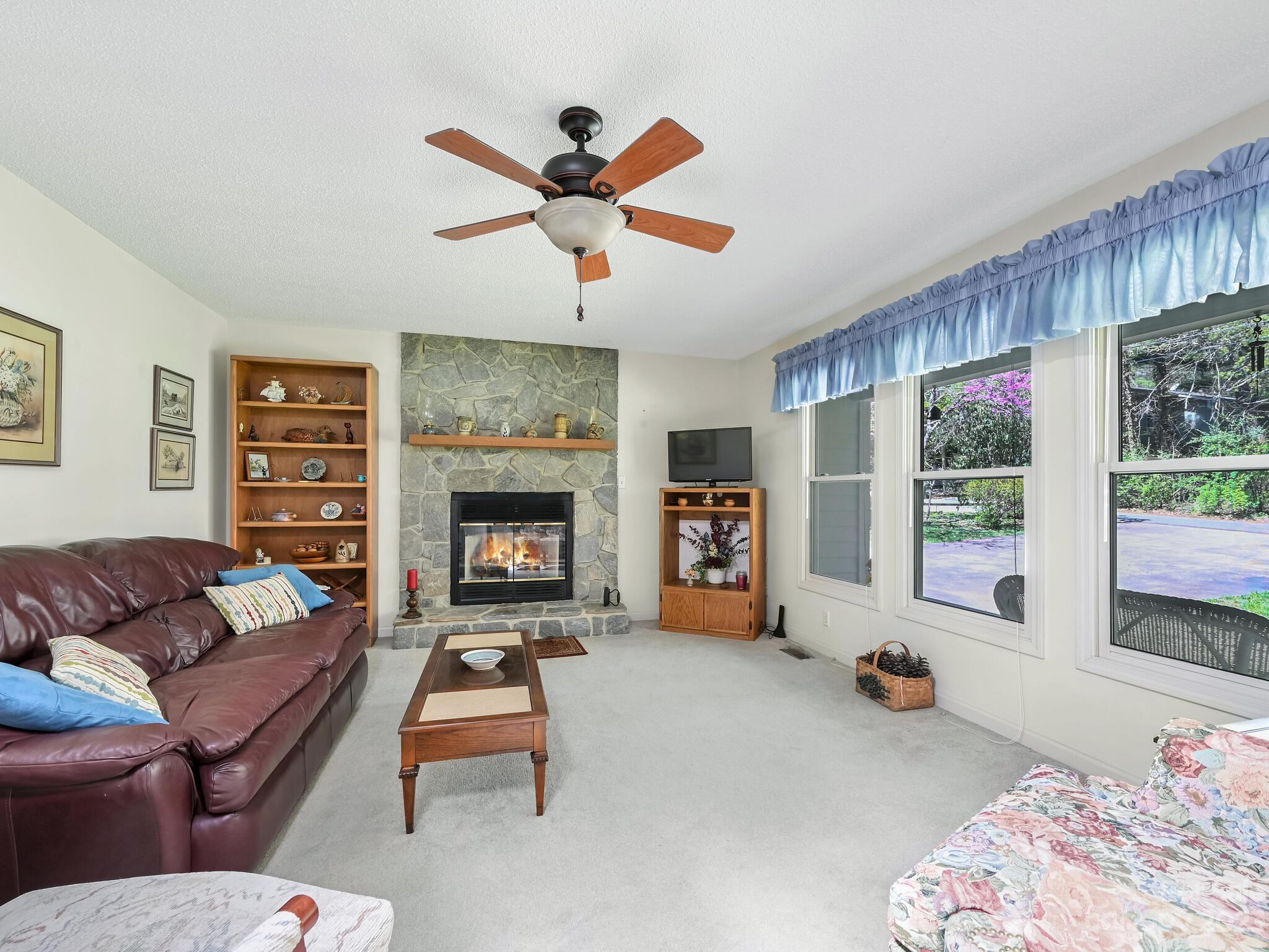 15 Maple Road Arden, NC 28704 - Photo 4 of 33 a living room with furniture and a fireplace