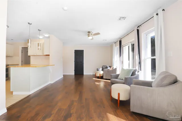 a living room with furniture and a large window