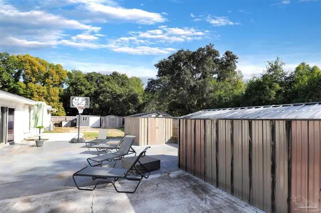 a view of house with a garden