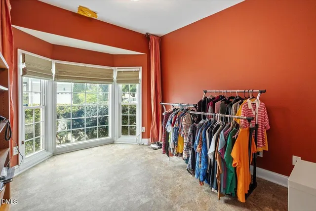 a view of a room with clothes and shoes