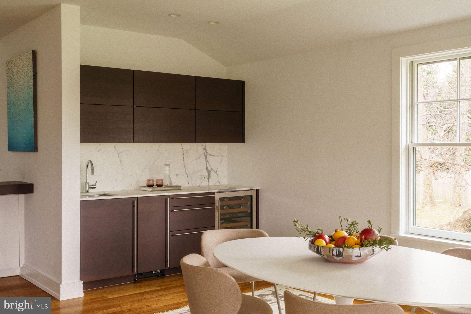 609 St Andrews Road Philadelphia, PA 19118 - Photo 13 of 43 a kitchen with a table and a chair