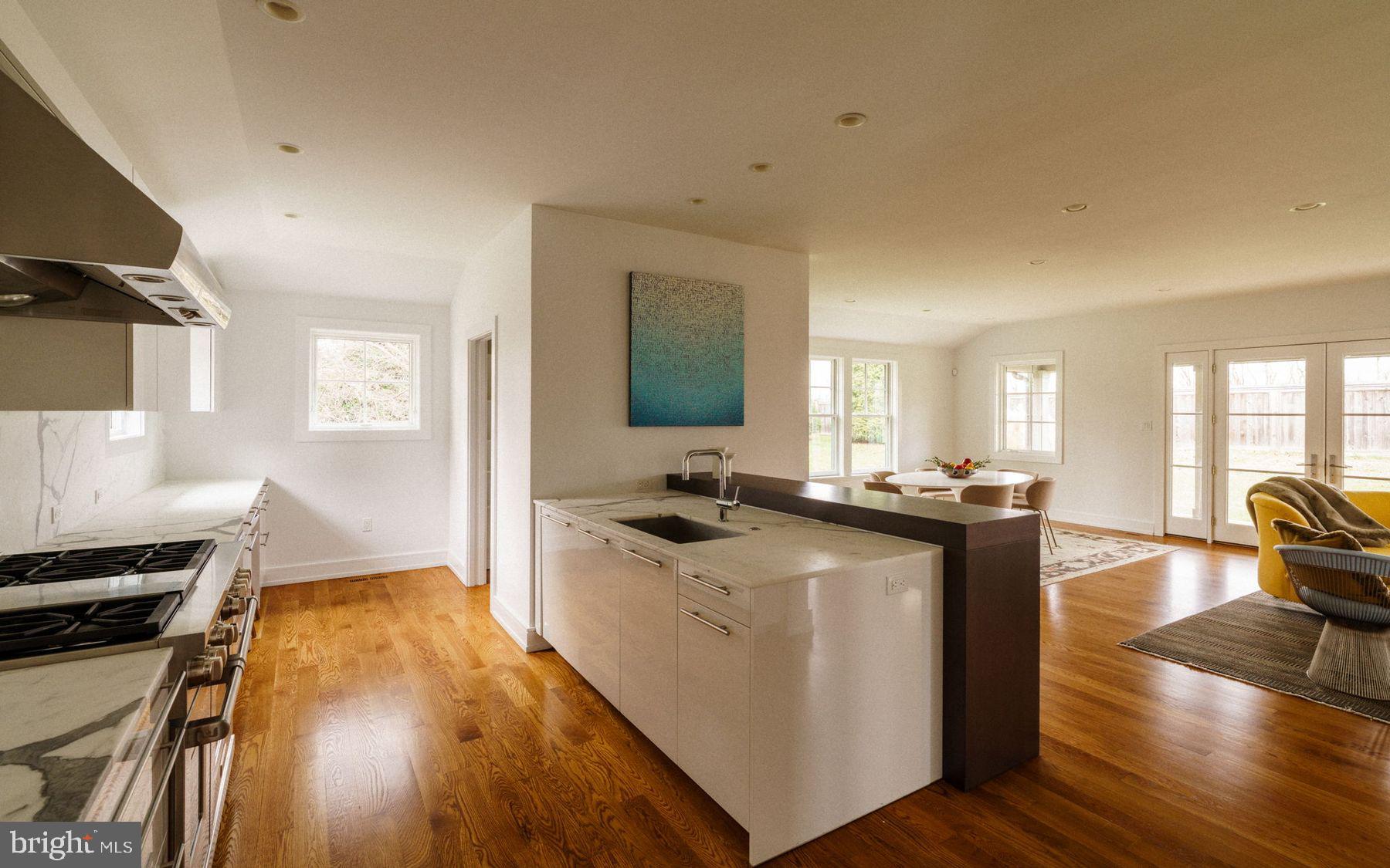 609 St Andrews Road Philadelphia, PA 19118 - Photo 15 of 43 a kitchen with a stove and a wooden floors