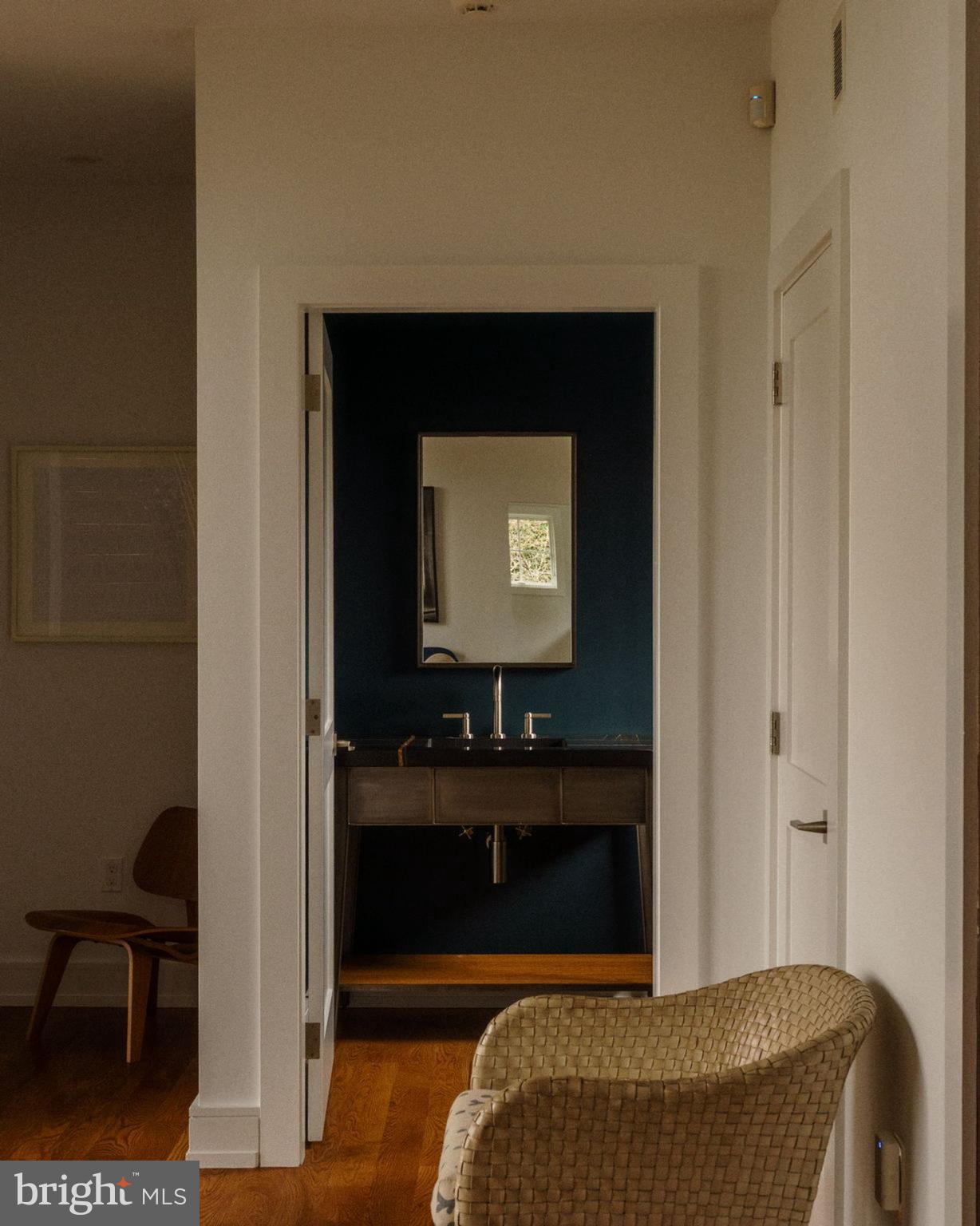 609 St Andrews Road Philadelphia, PA 19118 - Photo 18 of 43 a bedroom with a bed and a chair