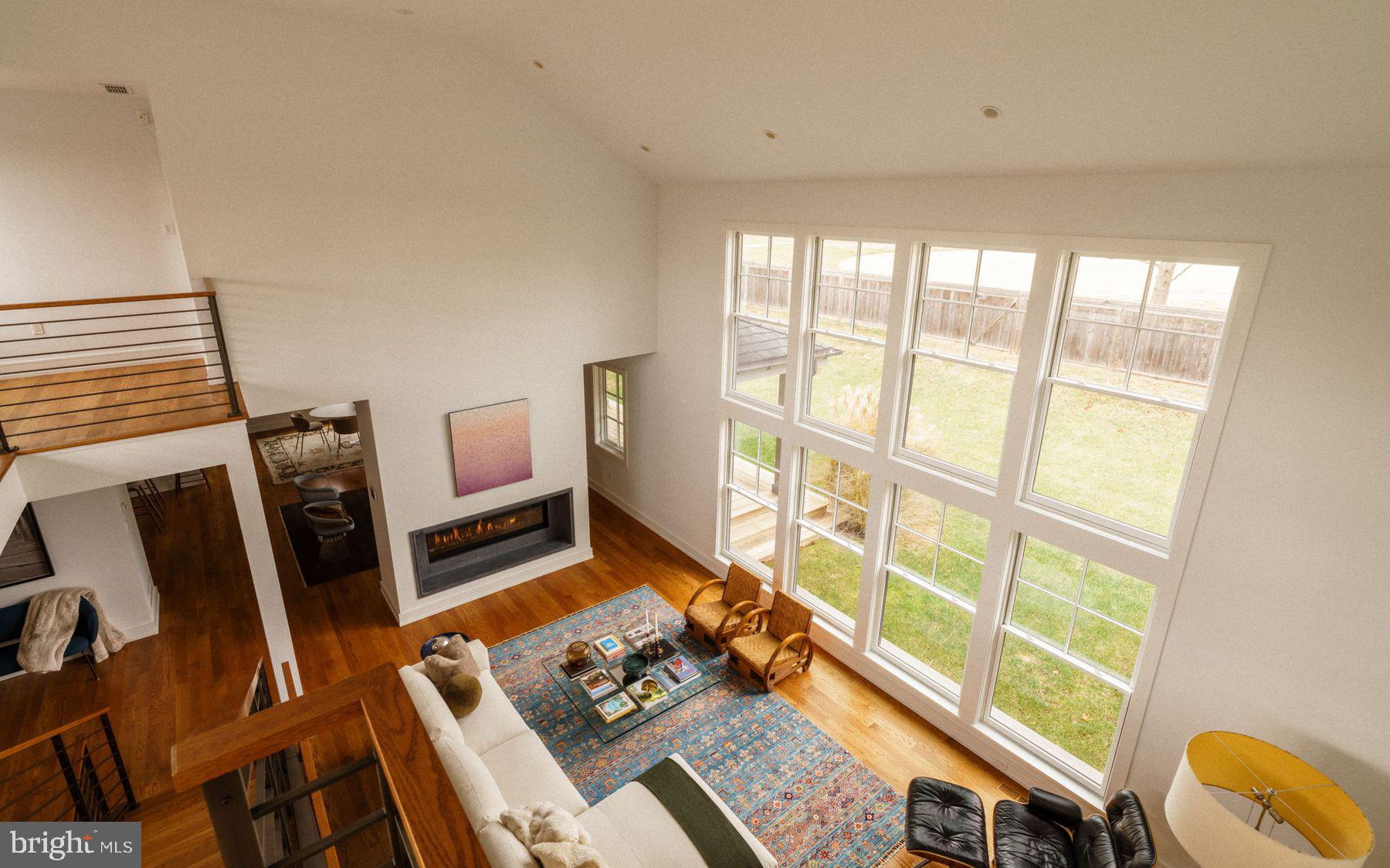 609 St Andrews Road Philadelphia, PA 19118 - Photo 24 of 43 a living room with furniture and a floor to ceiling window