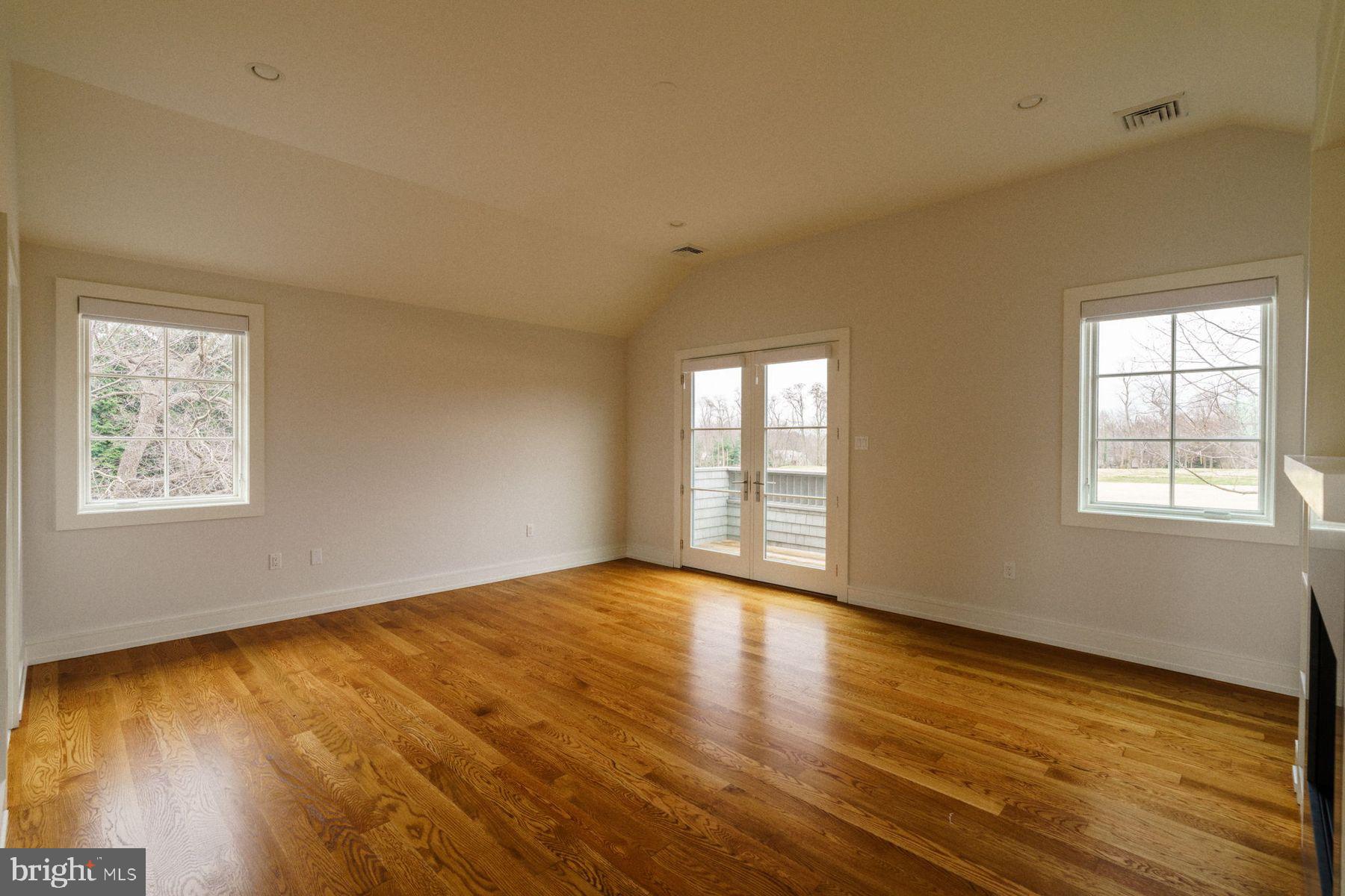 609 St Andrews Road Philadelphia, PA 19118 - Photo 29 of 43 a view of an empty room with wooden floor and a window