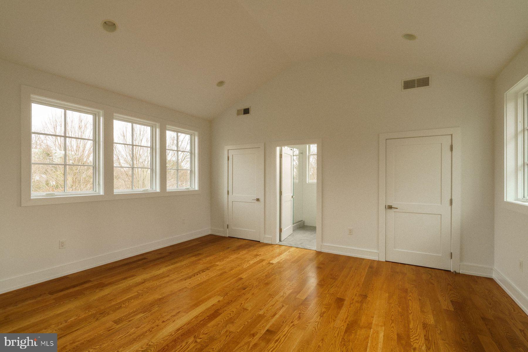 609 St Andrews Road Philadelphia, PA 19118 - Photo 34 of 43 a view of an empty room with wooden floor and a window